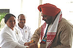 H.E. being tied Rakhi by Sis. BK Junu of Brahma Kumaris, Itanagar after being explained the spiritual significance of Raksha Bandhan by Dr. Jayadev Sahoo