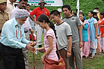 Lt Col Jaswant Singh Marwah(Retd), Father of the H.E. the Governor, giving away sweets to the hikers before the start of expedition