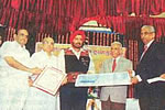 H.E. felicitating Dr. M. Srinivasan, of Arvind Eye Hospital, Madhurai at the Dr. M.C. Nahata Rashtriya Netr Puraskar function at Indore (M.P): 09/08/2009