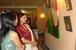 First Lady Anupama Singh going through the displays of in the Fine Arts exhibition at Hotel Arun Subansiri .:20/08/2010