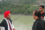 H.E. Governor taking up a point with his Secretary and DC Upper Siang at the construction site of Gandhi bridge : 05/04/2010