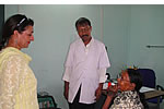 First lady interacting with a dental patient at Raj Bhawan Health Centre during special health check up programme. Sr. Surgeon Dr. P.K. Chutia, HoD(Dental) General Hospital also in the pic.: 09/03/2010