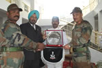 Governor presenting memento to 17 Maratha Light Infantry on its raising day at Tenga in West Kameng district, Arunachal Pradesh: 14/11/2010