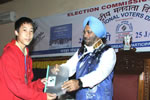 Governor handing over EPIC to a newly enrolled electorate on the occasion of the National Voters&rsquo; Day celebration at Banquet Hall, Itanagar: 25/01/2011