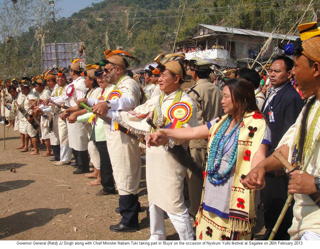 Governor General(Retd) JJ Singh along with Chief Minister Nabam Tuki taking part in �Buya� on the occasion of Nyokum Yullo Festival at Sagalee: 26/02/2013
