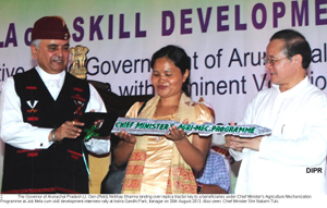 The Governor of Arunachal Pradesh Lt. Gen (Retd) Nirbhay Sharma landing over replica tractor key to a beneficiaries under Chief Minister�s Agriculture Mechanization Programme at Job Mela cum skill development interview rally at Indira Gandhi Park, Itanagar on 30th August 2013. Also seen: Chief Minister Shri Nabam Tuki