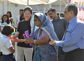 The First Lady of the State Smt Rita Rajkhwa distributing the prizes to the winners of games and sports competitions during the Children�s Day celebration at Raj Bhavan, Itanagar on 14th November 2015. Also seen: The Governor of Arunachal Pradesh Shri JP Rajkhowa.