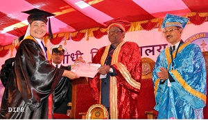 The Governor of Arunachal Pradesh Shri V. Shanmuganathan giving away the Degree of Doctor of Philosophy to Penny Rose Chinir (Tribal Studies) in the 14th Convocation of Rajiv Gandhi University, Rono Hills, Doimukh on 30th November 2016. 