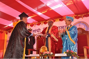 The Governor of Arunachal Pradesh Shri V. Shanmuganathan giving away the Degree of Doctor of Philosophy to Leki Norbu (Geography) in the 14th Convocation of Rajiv Gandhi University, Rono Hills, Doimukh on 30th November 2016. 