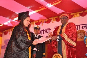 The Governor of Arunachal Pradesh Shri V. Shanmuganathan giving away the Degree of Doctor of Philosophy to Goken Geyi (History) in the 14th Convocation of Rajiv Gandhi University, Rono Hills, Doimukh on 30th November 2016. 