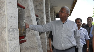 The Governor of Arunachal Pradesh Shri Tathagata Roy rotating the prayer wheel at Buddhist Gompa, Itanagar on 10th July�2016.