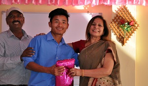 TThe First Lady of the State Smt Neelam Mishra giving prize to the best student of Donyi Polo Mission School for the Hearing and Visually Impaired during the �World Day for the Disabled� celebration, Chimpu, Itanagar on 3rd December 2017.