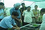 Governor introducing new orchids at Raj Bhawan Orchid House. Also seen is Orchodologist Dr. A.N. Rao