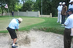 Governor showing some finer points of bunker shots to Golf orientation camp participants