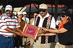 Governor and First lady presenting a Memento to Golf coach Shri Ali Sher