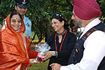 The First lady presents honey produced in the Rajbhawan to the President