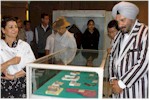 Governor Gen J.J. Singh tries his hand on the long drum, THAMKHAM of Wancho and Nocte tribes of Tirap district